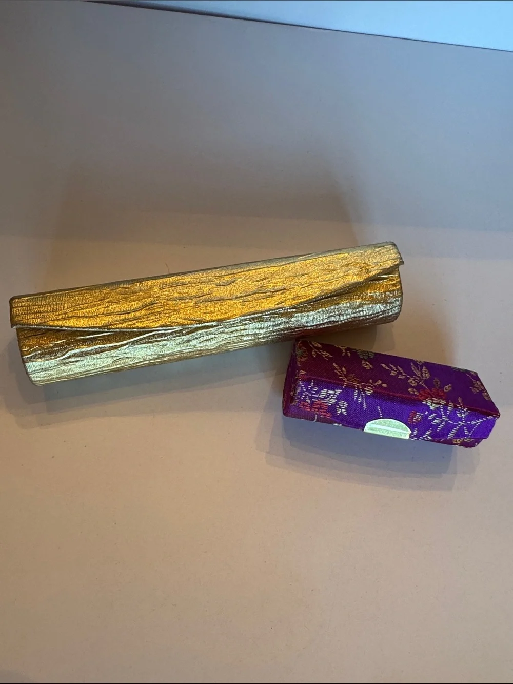 Estee Lauder Gold lipstick holder and Purple Decorative Lipstick holder